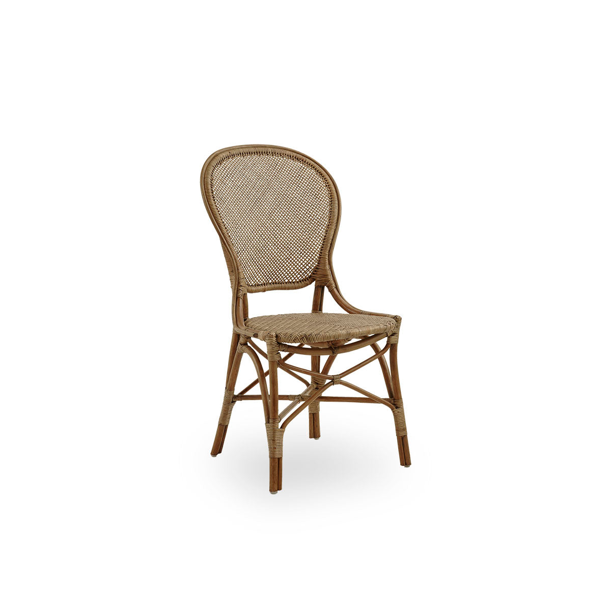Side view of Rossini dining chair in antique brown color. Elegant wicker chair with round backrest in simple design. Handcrafted from high quality rattan.