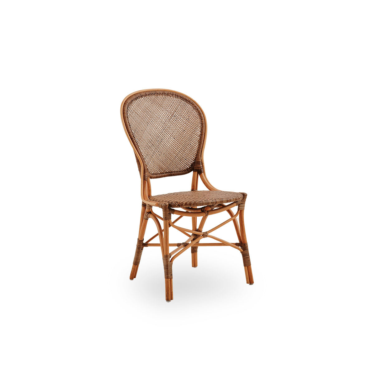Side view of Rossini dining chair in Cherry color. Elegant wicker chair with round backrest in simple design. Handcrafted from high quality rattan.