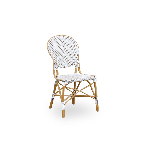 Seitenansicht des Isabell Outdoor-Esstuhls. Rahmen aus mandelfarbenem Aluminium mit Sitz und Rückenlehne aus weißem ArtFibre mit braunen Punkten. Inspiriert vom Bistro-Design der 1950er Jahre.