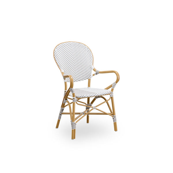 Seitenansicht des Isabell Outdoor-Esstuhls. Rahmen aus mandelfarbenem Aluminium mit Sitz und Rückenlehne aus weißem ArtFibre mit braunen Punkten. Inspiriert vom Bistro-Design der 1950er Jahre.