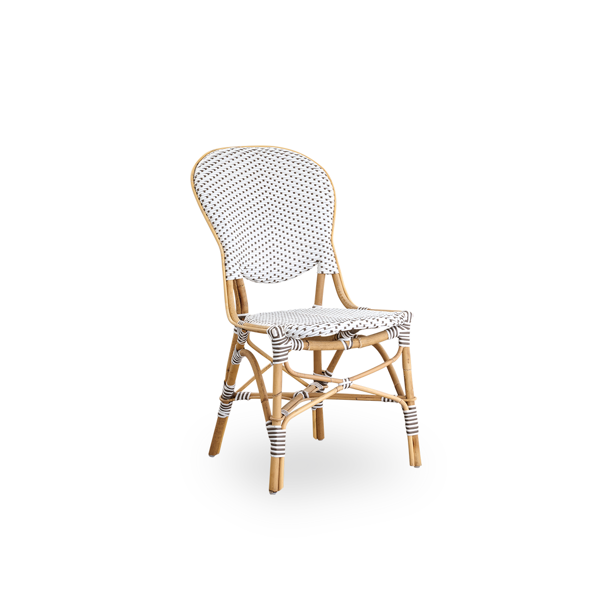Seitenansicht des Isabell Essstuhls. Rattangestell mit Sitz- und Rückenfläche aus weißem ArtFibre mit braunen Punkten. Inspiriert vom Bistrodesign der 1950er Jahre.