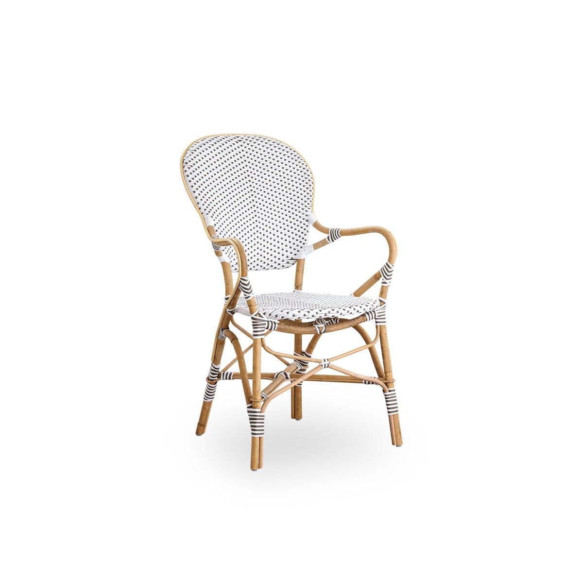 Side view of Isabell dining chair with armrest. Rattan frame with seat and backrest made in white ArtFibre with brown dots. Inspired by 1950s bistro design.