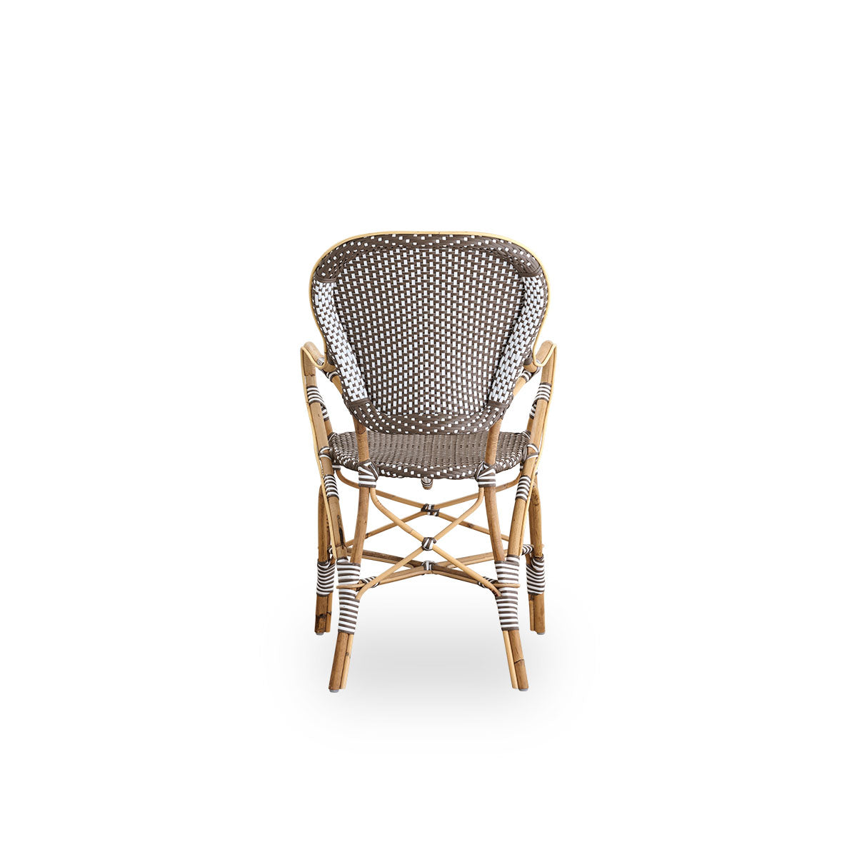 Plain back view of Isabell dining chair with armrest. Rattan frame with seat and backrest made in brown ArtFibre with white dots. Inspired by 1950s bistro design.