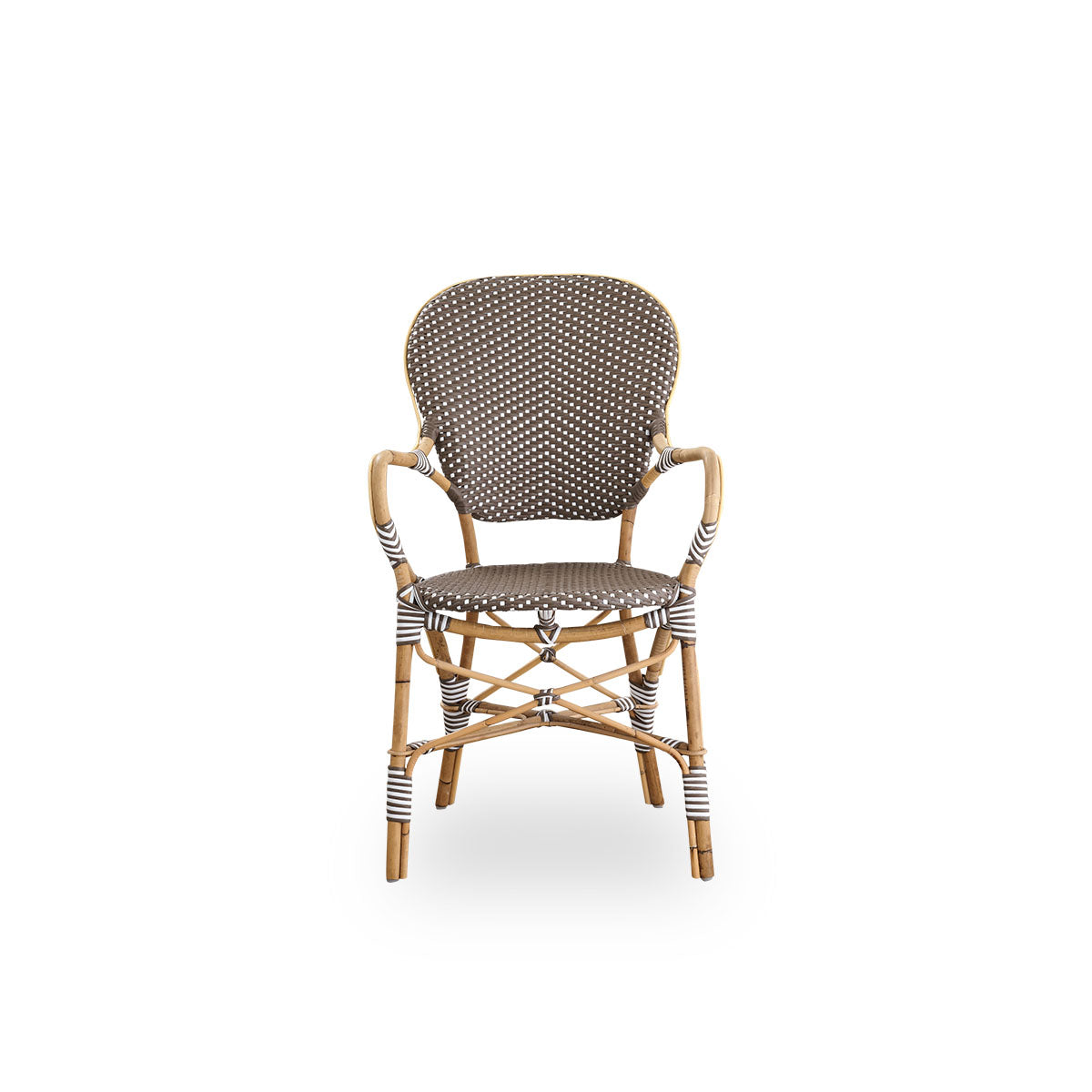 Front view of the Isabell dining chair with armrests.
Rattan frame with seat and backrest made in brown ArtFibre with white dots. Inspired by 1950s bistro design.