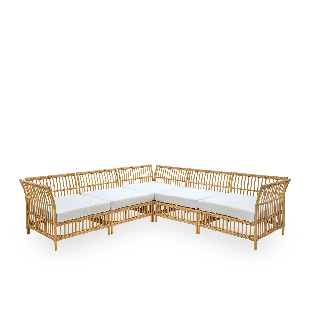 Side view of Maggie outdoor sofa corner module in Natural color presented with white seat and back cushion. Aluminium frame with handpainted rattan look with ArtFibre windings.